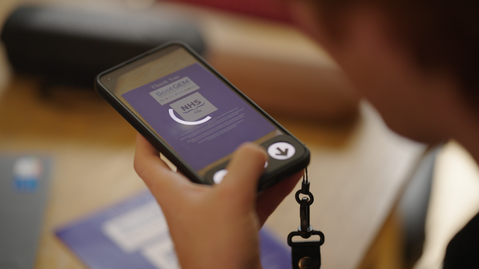 Image of a person holding a phone
